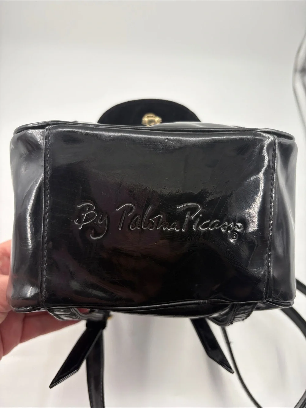 Paloma Picasso Black Patent Mini Backpack with Gold X Hardware